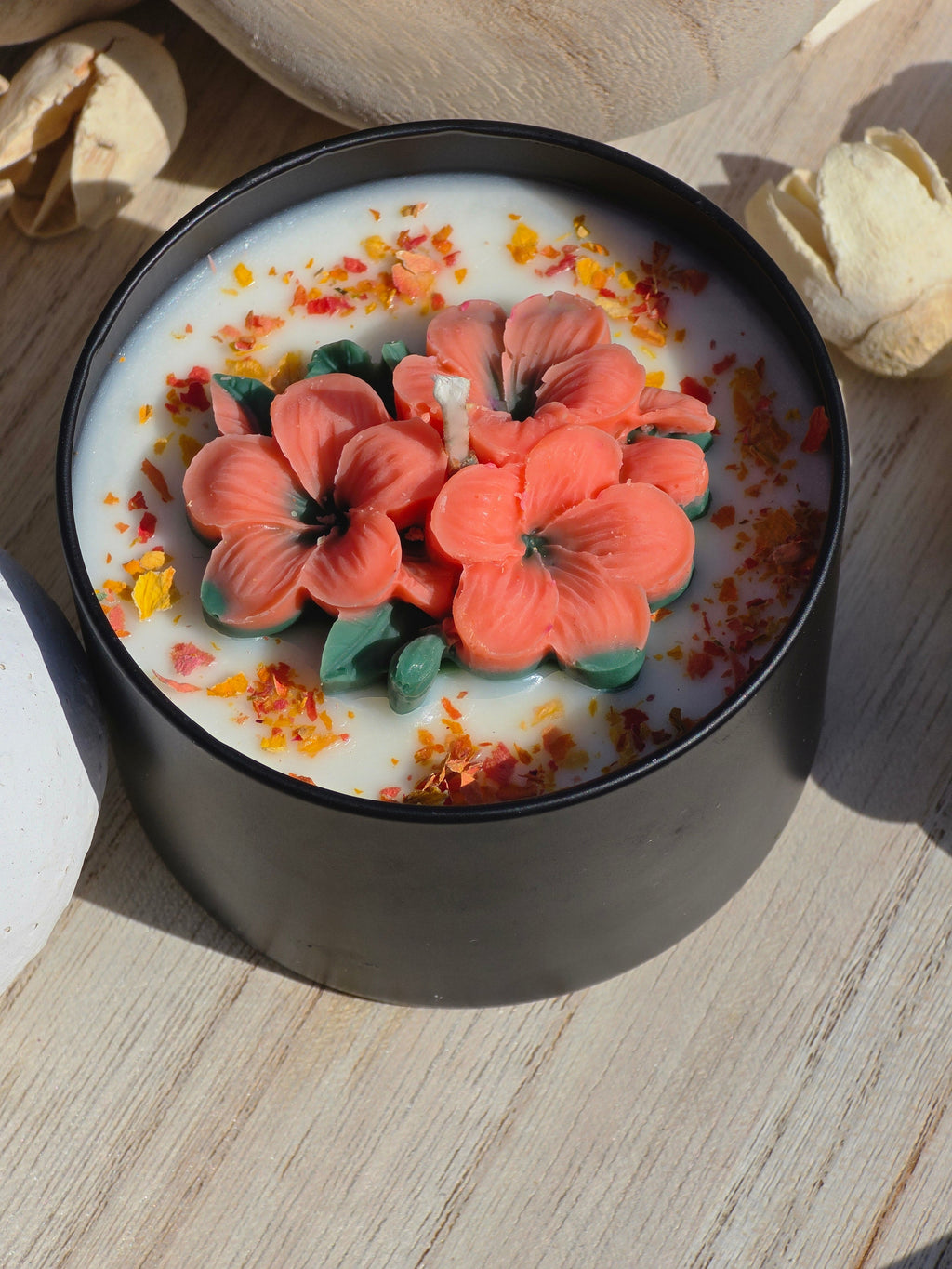 Handmade hibiscus candle close up