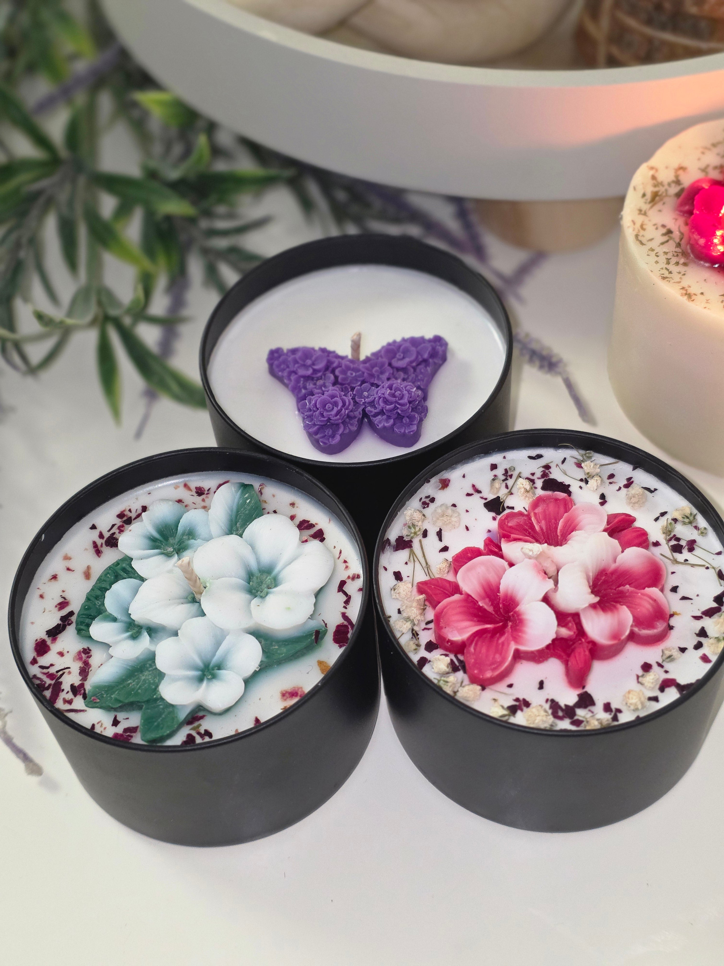 Botanical candles styled with greenery