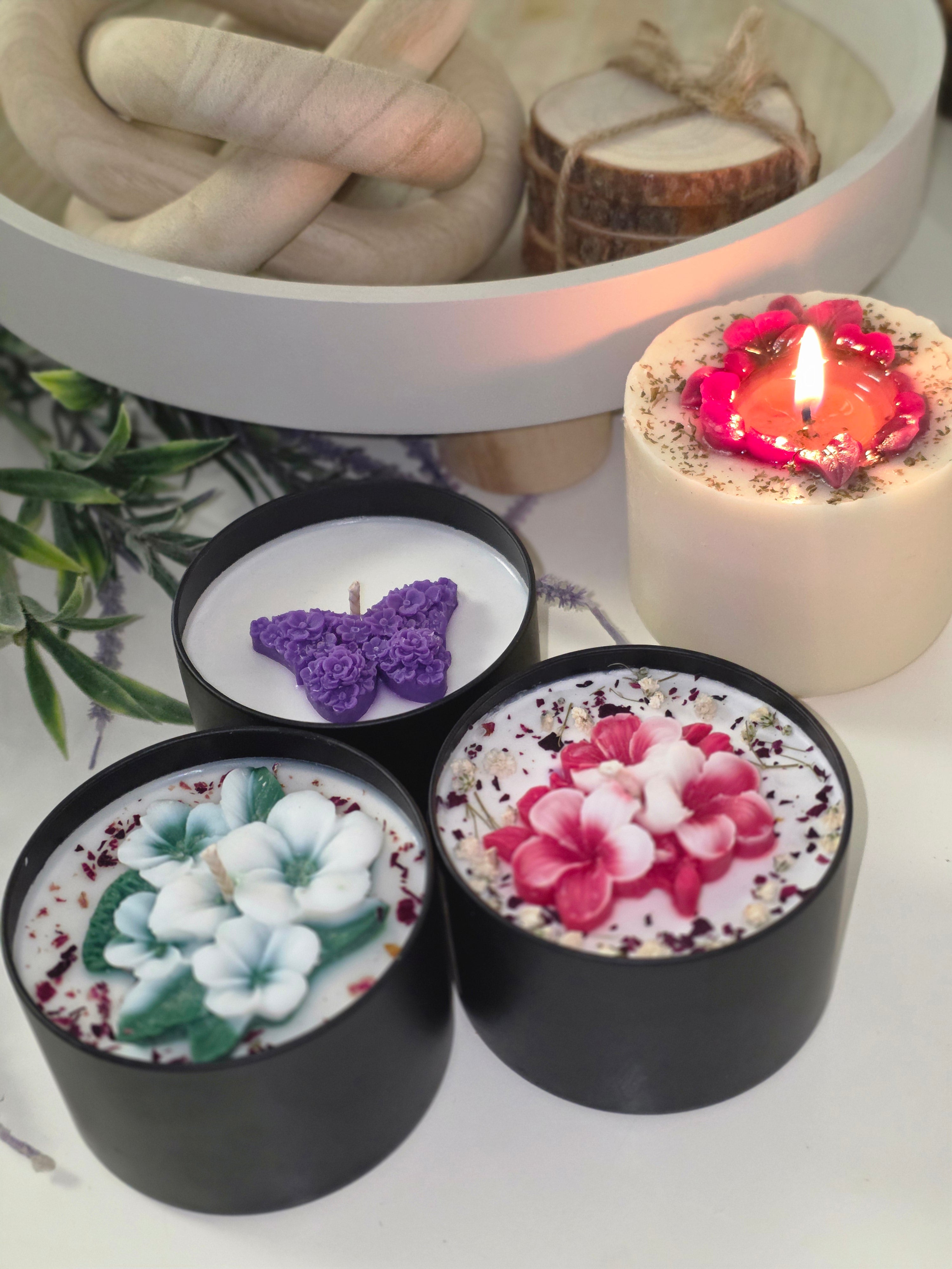 Three handmade candles with wax sculptures