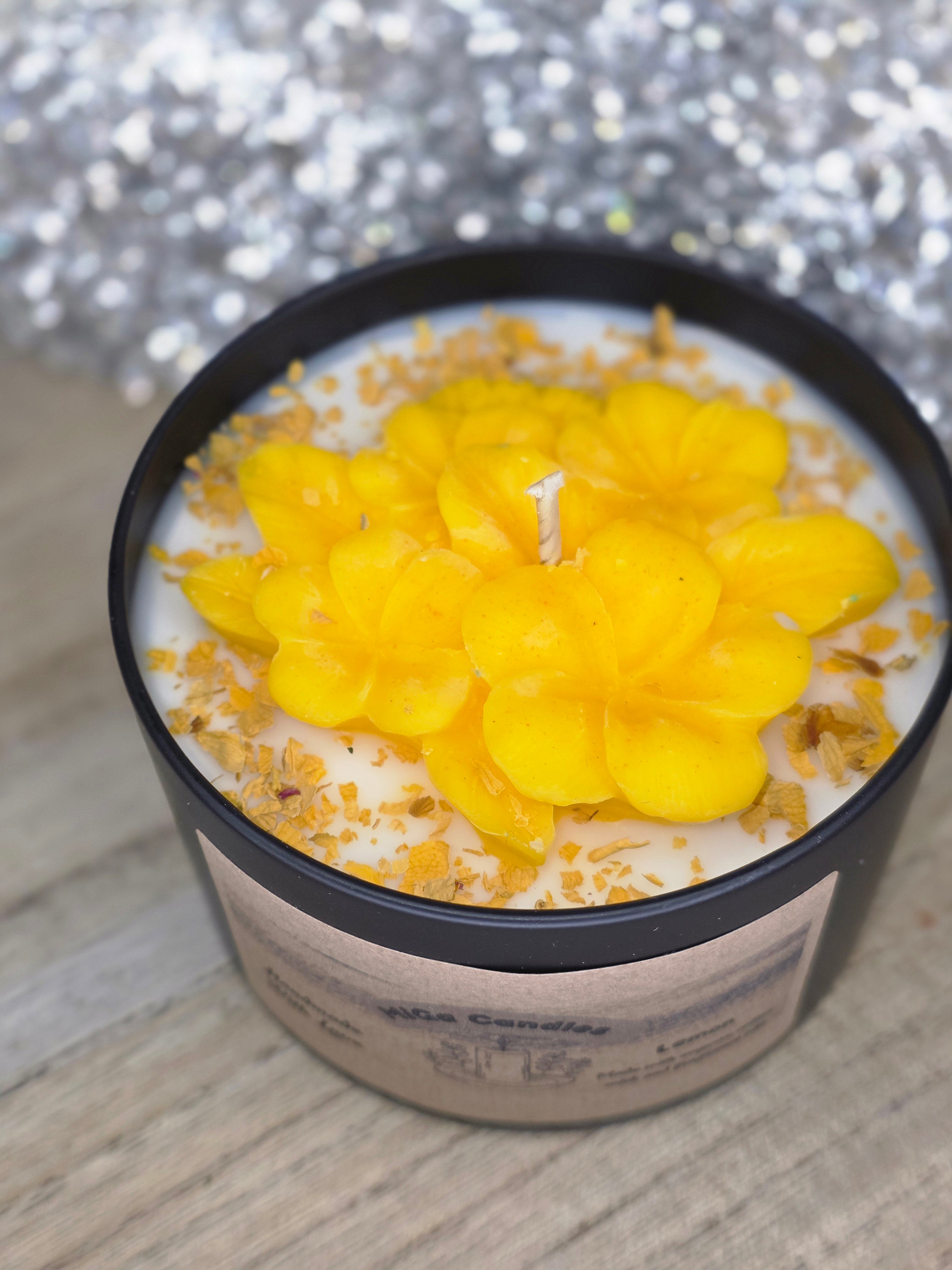 Top view of botanical flower candle with yellow wax flowers