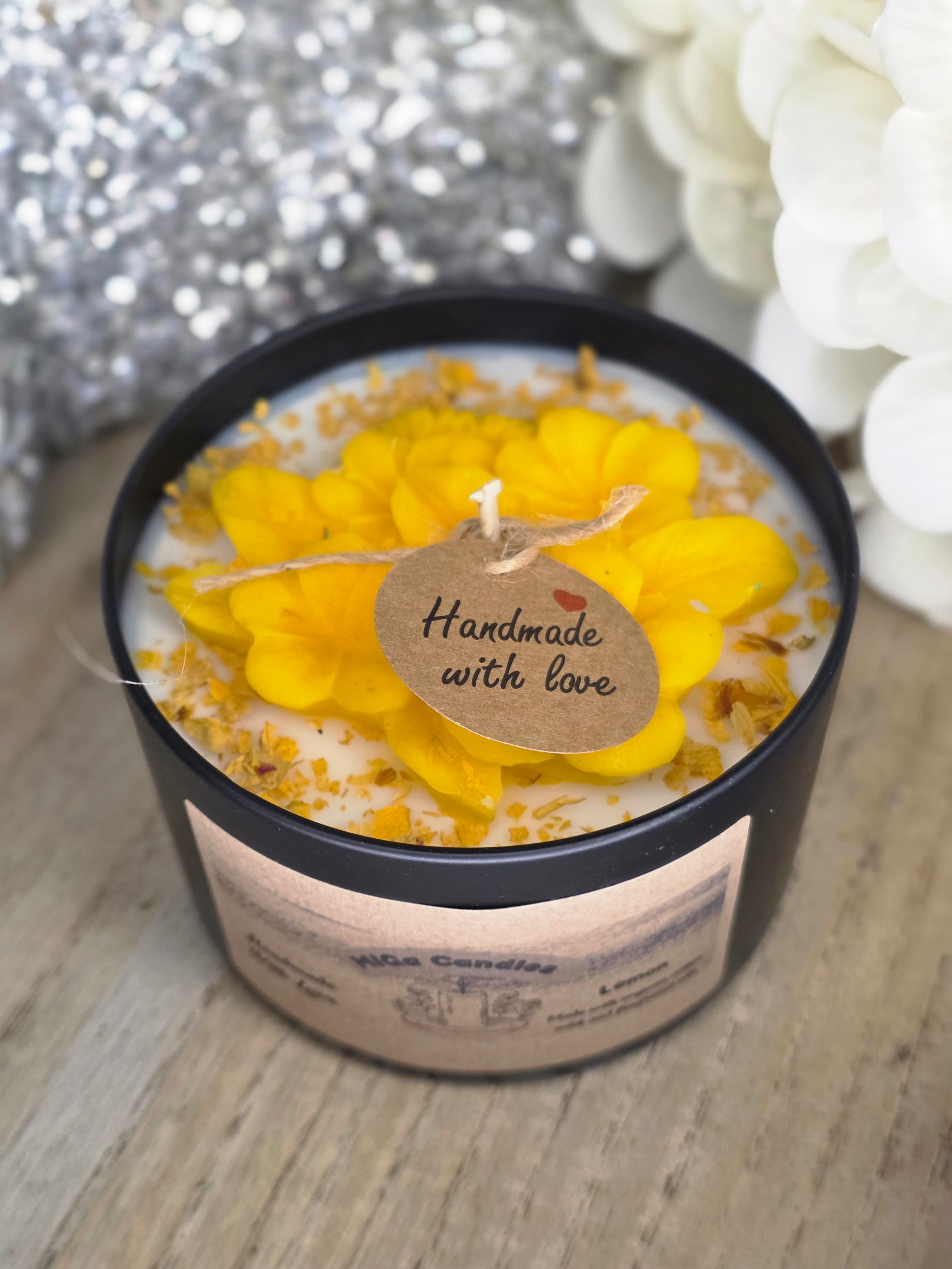 Botanical flower candle in matte black tin - top view