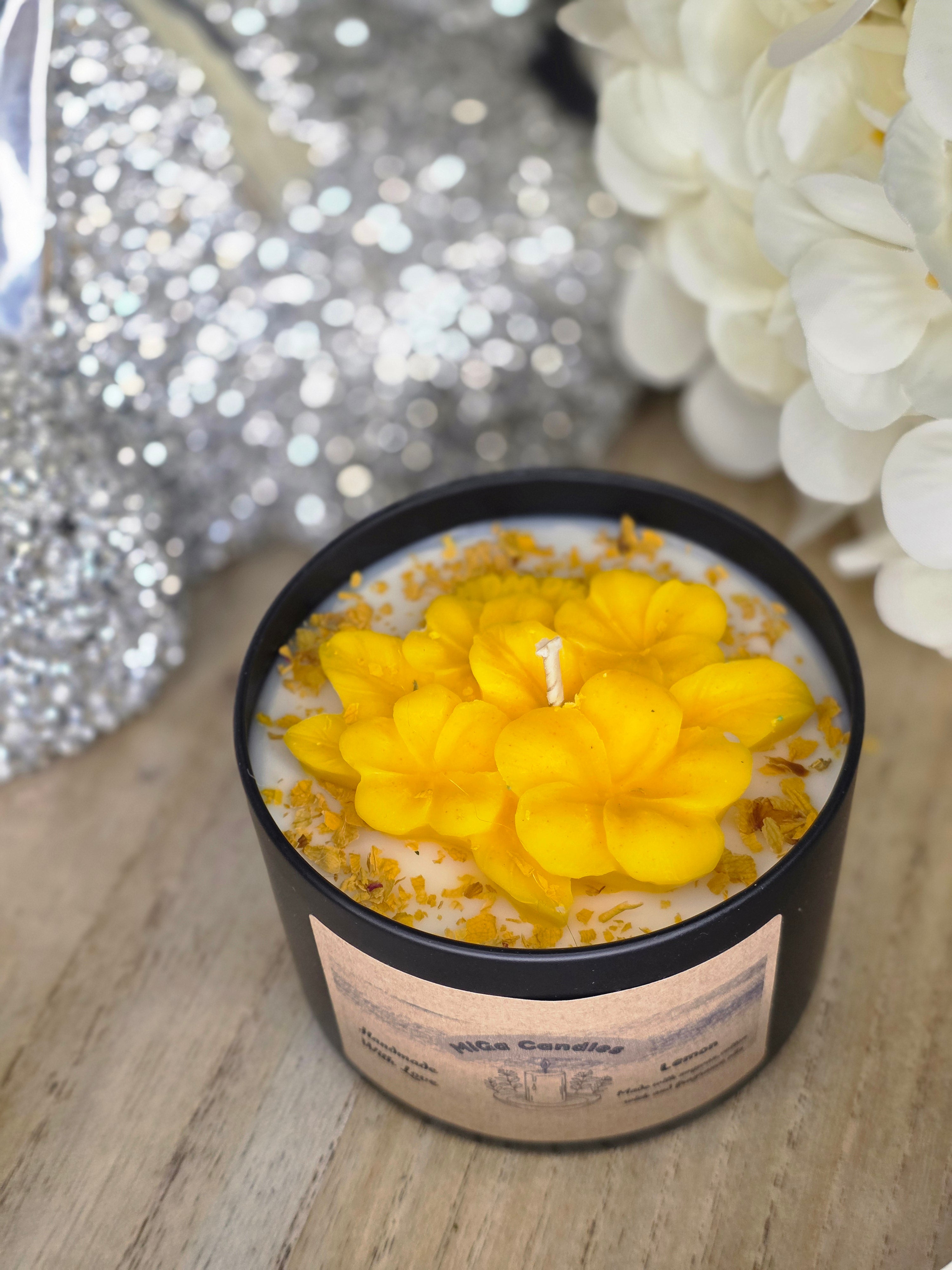 Botanical candle with yellow flowers - close up